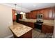Renovated kitchen with granite counters and stainless steel appliances at 310 Chaney St, Wingate, NC 28174