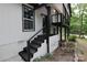 Black painted stairs leading to a deck and entrance at 310 Chaney St, Wingate, NC 28174
