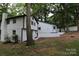 White house with black accents and a deck at 310 Chaney St, Wingate, NC 28174