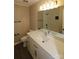 Updated bathroom features a white vanity, quartz countertop, and a large mirror at 310 Chaney St, Wingate, NC 28174