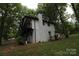 White house with black accents and a balcony at 310 Chaney St, Wingate, NC 28174