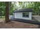 View of the house showcasing a deck and surrounding trees at 310 Chaney St, Wingate, NC 28174