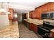 Renovated kitchen with granite counters and stainless steel appliances at 310 Chaney St, Wingate, NC 28174