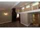 Open living area with loft, fireplace and kitchen views at 310 Chaney St, Wingate, NC 28174