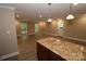 Kitchen with granite countertops and hardwood floors at 310 Chaney St, Wingate, NC 28174