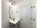 Single vanity bathroom with modern fixtures and mirror at 5348 Almeda Pl, Concord, NC 28027