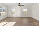 Bright living room featuring hardwood floors and large windows at 57 Pickney St, York, SC 29745