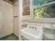 Small bathroom with shower, sink, and vintage tile at 1418 Oakwood Ave, Kannapolis, NC 28081
