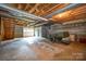 Unfinished basement with garage access and ample storage at 1418 Oakwood Ave, Kannapolis, NC 28081