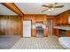 Bright kitchen with wood cabinets, stainless steel appliances, and tiled floors at 1418 Oakwood Ave, Kannapolis, NC 28081