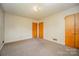 Simple bedroom with carpet and two closets at 1418 Oakwood Ave, Kannapolis, NC 28081