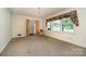 Bright living room with window and carpet at 1418 Oakwood Ave, Kannapolis, NC 28081