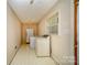 Bright laundry room, with washer, dryer and refrigerator at 1418 Oakwood Ave, Kannapolis, NC 28081