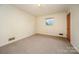 Simple bedroom with carpet, window and closet at 1418 Oakwood Ave, Kannapolis, NC 28081