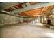 Unfinished basement with kitchenette and stone fireplace at 1418 Oakwood Ave, Kannapolis, NC 28081