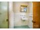 Clean bathroom with shower, sink, and tile floor at 1418 Oakwood Ave, Kannapolis, NC 28081
