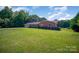 Brick ranch home with a two-car garage and expansive yard at 1418 Oakwood Ave, Kannapolis, NC 28081