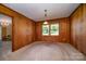 Spacious dining room with wood paneling and carpet at 1418 Oakwood Ave, Kannapolis, NC 28081