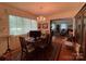 Formal dining room with chandelier and hardwood floors at 506 Hearne Farm Rd, Mount Gilead, NC 27306