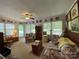 Bright living room with large windows and comfy seating at 506 Hearne Farm Rd, Mount Gilead, NC 27306