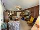 Living room with brick accent wall and rocking chair at 506 Hearne Farm Rd, Mount Gilead, NC 27306