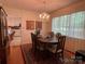Dining room with chandelier and kitchen view at 506 Hearne Farm Rd, Mount Gilead, NC 27306