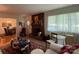Living room with a fireplace and views into dining area at 506 Hearne Farm Rd, Mount Gilead, NC 27306