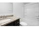 Clean bathroom with granite countertop, tub, and shower at 1015 Beacon Ave # 36, Monroe, NC 28110