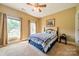 Comfortable bedroom with ceiling fan and large windows at 2073 Hambridge Ave, Kannapolis, NC 28081