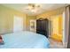 Bright bedroom with ceiling fan and access to bathroom at 2073 Hambridge Ave, Kannapolis, NC 28081