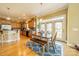 Bright kitchen with wood cabinets, island, and breakfast area with door to backyard at 2073 Hambridge Ave, Kannapolis, NC 28081