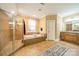 Spa-like bathroom with a large soaking tub, walk-in shower, and double vanity at 2073 Hambridge Ave, Kannapolis, NC 28081