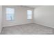 Spacious bedroom with neutral carpeting and ample natural light at 3820 Shider Ln, Kannapolis, NC 28081