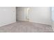 Well-lit bedroom with carpeting and access to a full bathroom at 3820 Shider Ln, Kannapolis, NC 28081