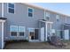 Rear view of townhome with sliding glass door to patio at 3820 Shider Ln, Kannapolis, NC 28081