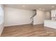 Bright living room featuring hardwood floors and an open staircase at 3820 Shider Ln, Kannapolis, NC 28081