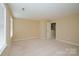 Spacious, empty bedroom with neutral-colored walls, carpeting, and windows at 703 Lexington Dr, Albemarle, NC 28001