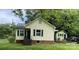 Charming yellow house with a detached building and a yard at 635 Hillcrest Dr, Shelby, NC 28150