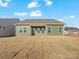 Rear view of house showcasing backyard and covered patio at 1025 Bull Dog Ln # 5, Wingate, NC 28174