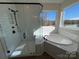 Modern bathroom with a walk-in shower and a soaking tub at 2027 Cedar Falls Dr # 75, Waxhaw, NC 28173