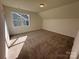 Spacious bedroom with carpeted floor and window at 2027 Cedar Falls Dr # 75, Waxhaw, NC 28173