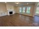 Spacious Gathering room with fireplace, built-ins, and hardwood floors at 2027 Cedar Falls Dr # 75, Waxhaw, NC 28173