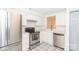 Updated kitchen with stainless steel appliances and patterned tile floor at 7340 Pebblestone Dr # C, Charlotte, NC 28212