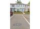 Parking lot in front of townhouses, with space number 7340C at 7340 Pebblestone Dr # C, Charlotte, NC 28212