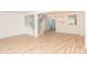 Spacious living room with light wood flooring and a chandelier at 7340 Pebblestone Dr # C, Charlotte, NC 28212