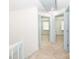Upstairs hallway with light blue doors leading to bedrooms at 7340 Pebblestone Dr # C, Charlotte, NC 28212