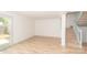 Bright living room with hardwood floors and sliding glass door to patio at 7340 Pebblestone Dr # C, Charlotte, NC 28212