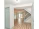 Open concept living area with light wood flooring and stairs at 7340 Pebblestone Dr # C, Charlotte, NC 28212