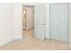 Bedroom with carpet, light blue doors, and adjacent bathroom at 7340 Pebblestone Dr # C, Charlotte, NC 28212