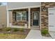 Inviting front porch with stone accents and a charming entryway at 4120 Village Nw Blvd, Conover, NC 28613